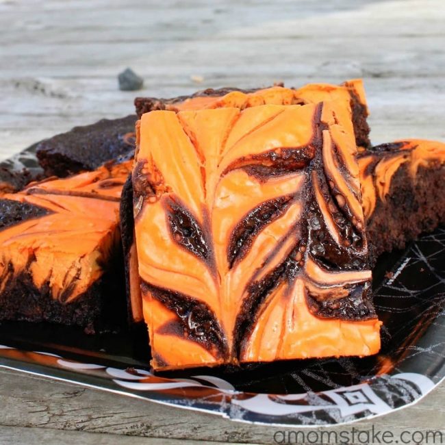 Easy Halloween Brownies recipe with a yummy cream cheese swirled throughout - plus swaps that make these brownies amazing!