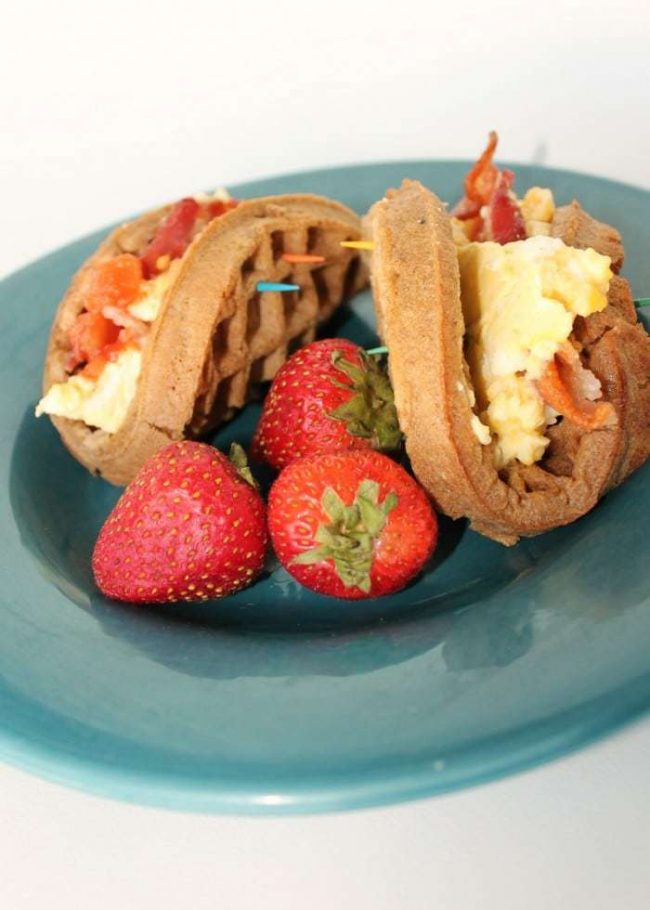 This is my go-to easy breakfast recipe! Just your favorite breakfast foods like eggs, sausage, bacon, cheese - whatever you love - crammed inside a tasty waffle! It's so fast and yet filling and healthy! Seriously, you've got to try to make these Breakfast Waffle Tacos!