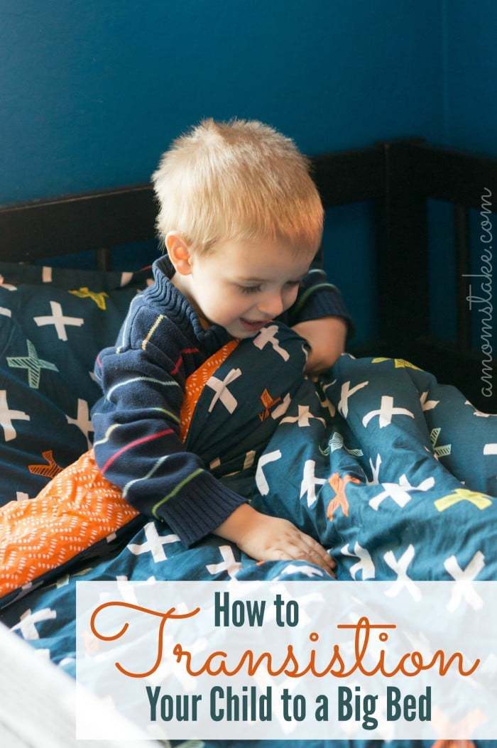 Simple tricks and tips on how to transition your child to a big bed, including how to know if they're ready for the big switch!