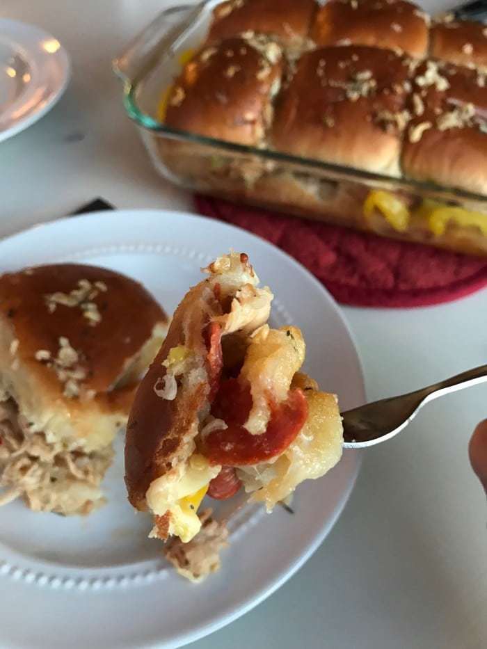 Loaded with flavors, these yummy, and so easy, Italian Chicken Sliders are one of my family's favorite dinner recipes! Pepperoni, chicken, banana peppers and an Italian dressing - yum!! 