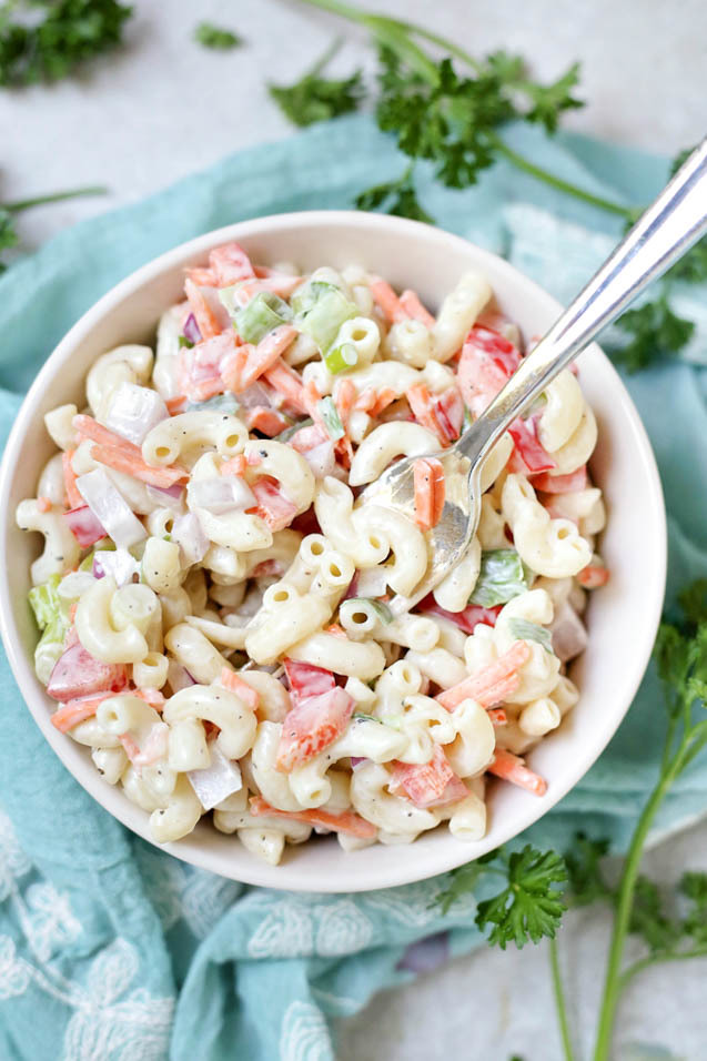This flavorful macaroni salad is the best we've ever tried! So easy to make and perfect for picnics and barbecues. Perfect side dish recipes for summer.