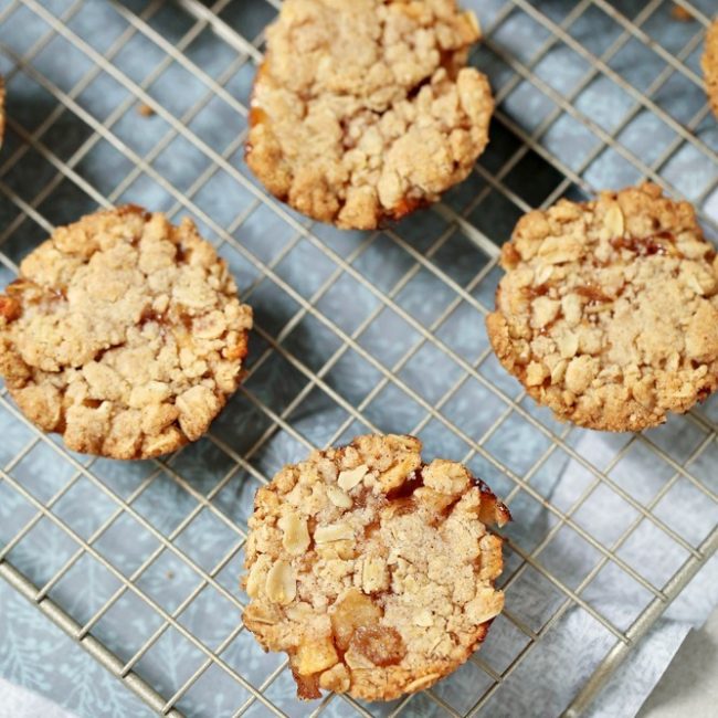 A fun and fruity cookie, this twist on traditional apple cobbler brings a warm and tasty cookie recipe you'll love! These apple cobbler cookies have a warm crumbly topping and sweet fruity inside.