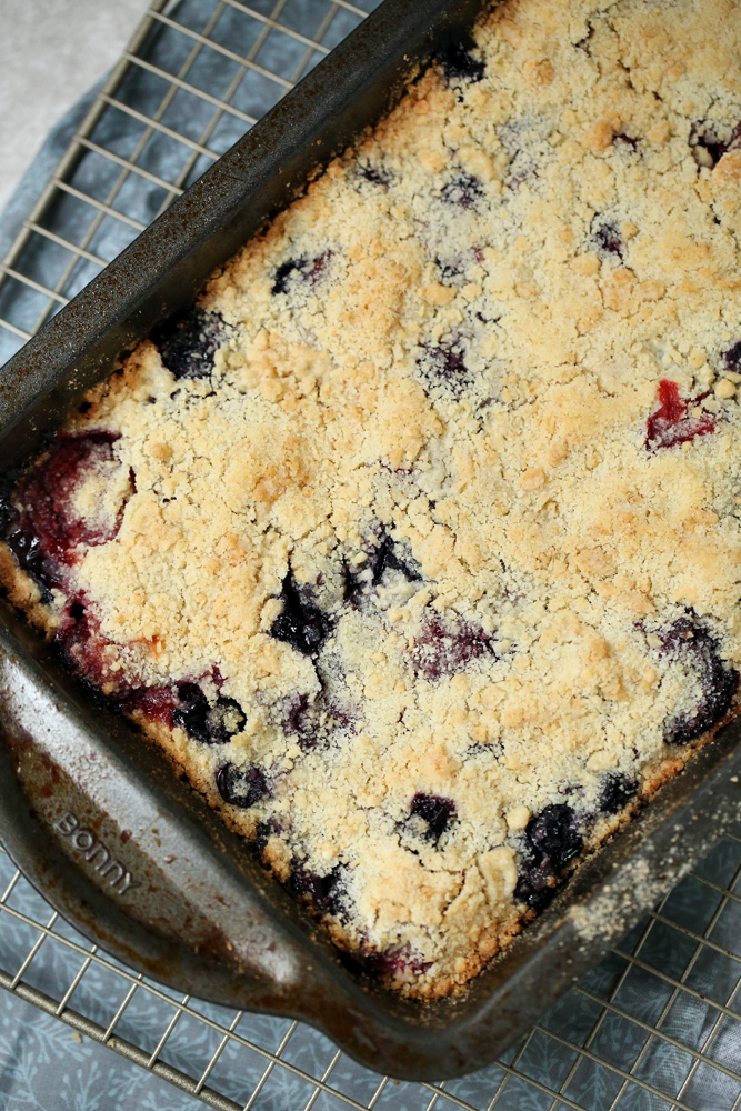 This warm dessert is perfect for summer and fall. These mixed berry crumble bars combine your favorite berries - add strawberries, blueberries, blackberries, and raspberries (or just your favorites) and top with yummy pie crumble layers!