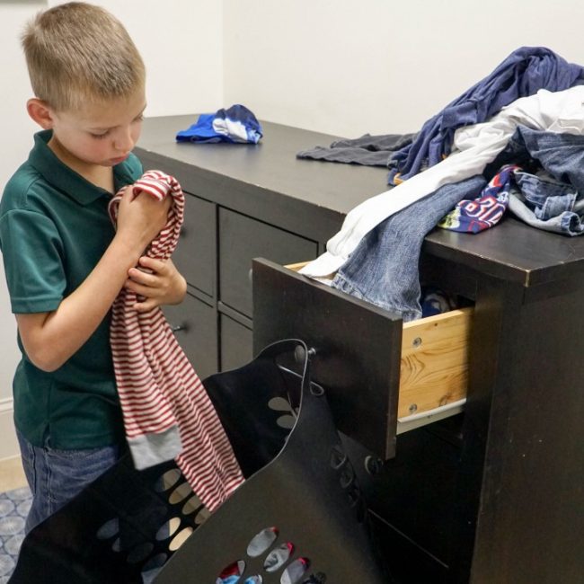 kid sorting laundry