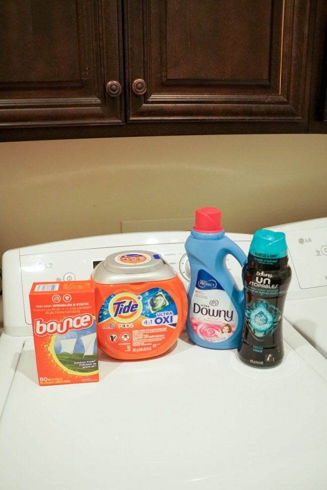 laundry care routine products on top of a washing machine