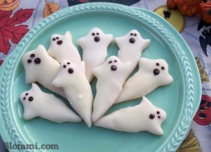 22 Tasty Halloween Treats to "Boo" Your Friends! white chocolate shortbread ghost halloween cookies 416x300 1